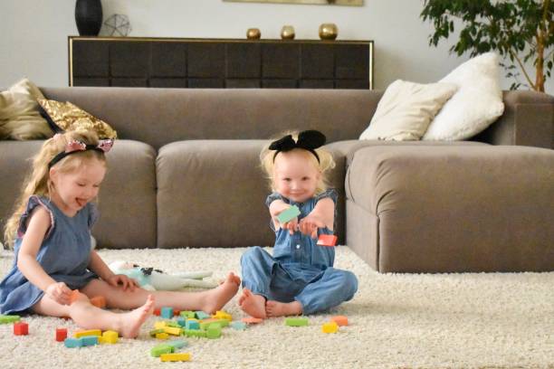 istock Playing little girls kids 1154032624