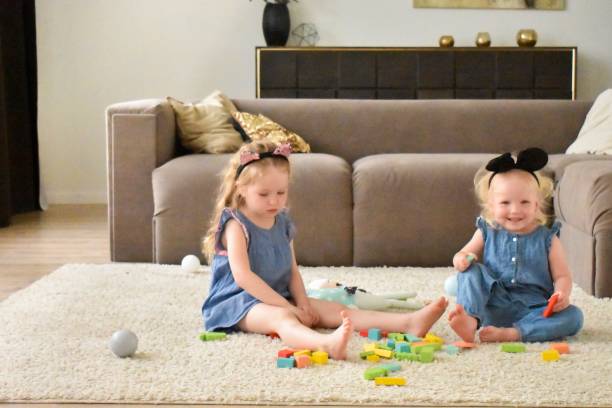 istock Playing little girls kids 1154032720