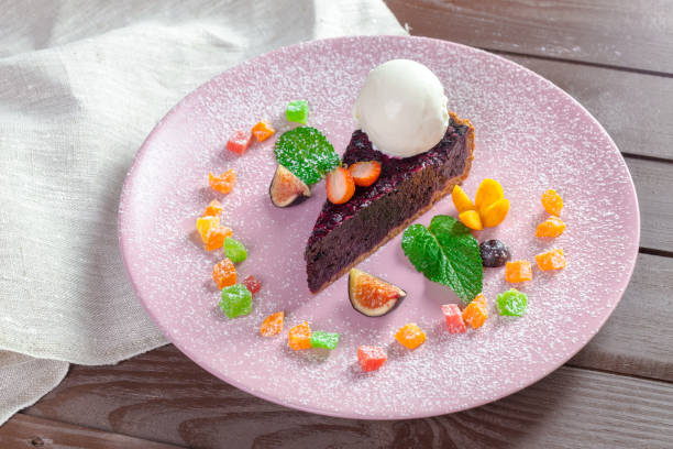 istock Piece of chocolate almond cornmeal cake with balsamic drizzle and ice cream 1154034149