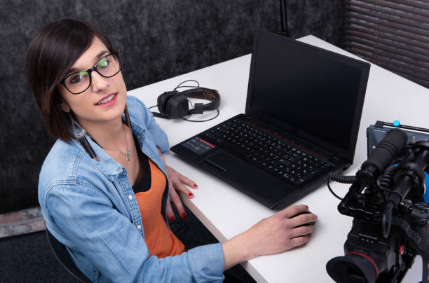 istock pretty young woman video editor working in studio 1154034299
