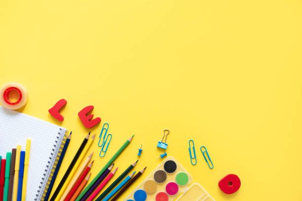 istock Various school accessories on yellow board with copy space. Concept back to school. 1154035392