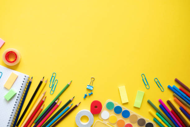 istock School supplies on yellow background. Concept back to school. Copy space 1154035455