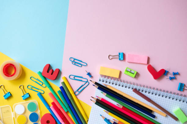 istock Back to school. Items for the school on a colorful  table. 1154035857