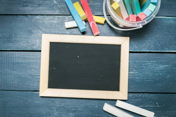 istock Small blackboard on old wood background 1154036876