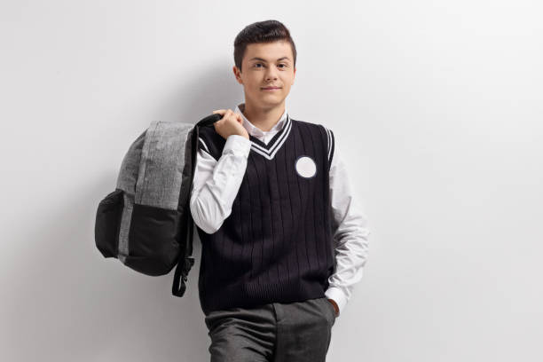 istock Male tenage student holding a backpack 1154037044
