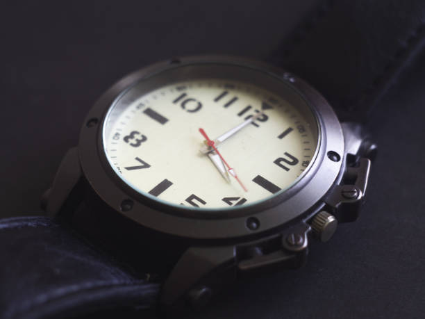 istock Black and white man watch close up 1154037370