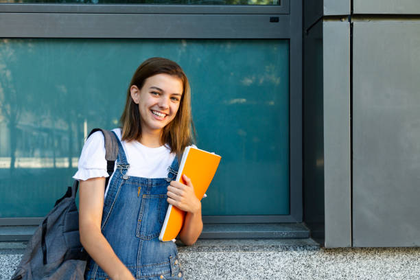 istock Happy student girl portrait 1154037378