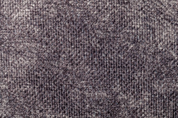 Light gray background from a soft textile material. sheathing fabric with natural texture. Cloth backdrop.