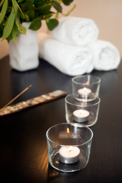 istock Spa equipment, towels, candles in a row, burning incense 1154038198