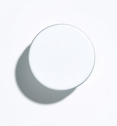 White round jar of facial moisturizer