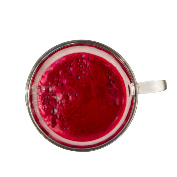 Beetroot juice in a glass isolated on white. Top view.