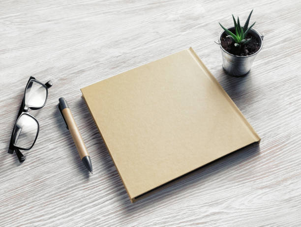 istock Sketchbook, glasses, pen, plant 1154039177