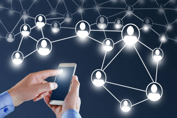 istock Hands of businessman on touching smart phone and flying network. 1154040476