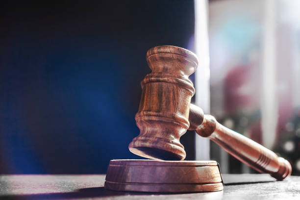 istock Judge's Gavel over black background 1154040939