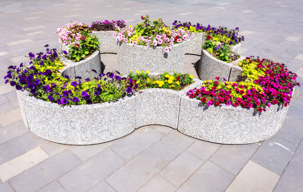 istock Granite decorative flower bed with different flowers 1154043848