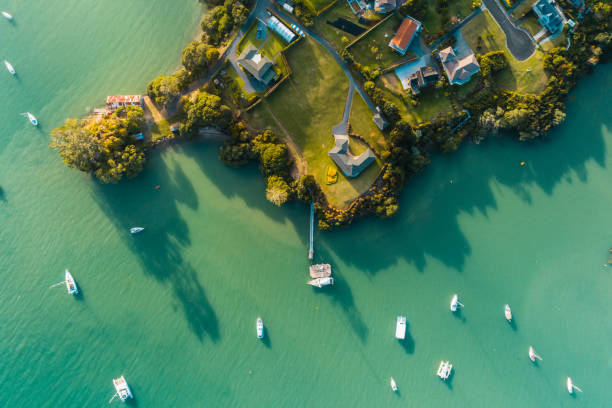 istock Houses next to beach and boat. 1154043934