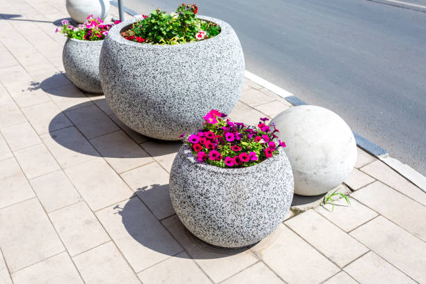 istock Granite decorative flower bed with different flowers 1154043983