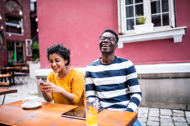 istock Two young friends at the bar. 1154046753