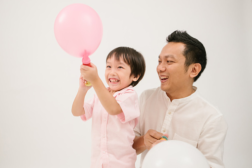 Thailand, blowing, balloon, family, father, son, love, pink color, studio,Air pump