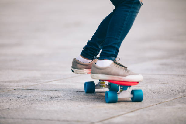 istock skateboarder legs skateboarding at city 1154047558