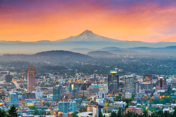 Portland, Oregon, USA downtown Portland, Oregon, USA downtown skyline with Mt. Hood at dawn. pacific northwest photos stock pictures, royalty-free photos & images