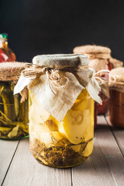 istock Preserved vegetables on wooden background 1154050079