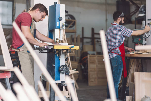 istock Professional carpenters working at the atelier 1154050231