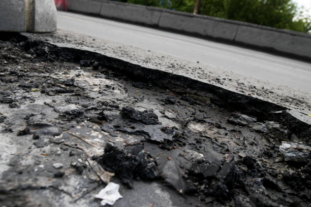 istock Cracked surface of an asphalt road 1154050475