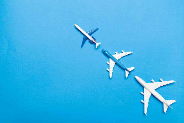 istock model of passenger plane on blue background 1154051769