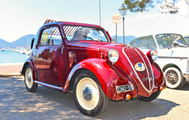 Vintage red  Fiat 500 Topolino (model 1936) Italy car on the street of Lerici Liguria, Italy 20.05.2018.Vintage red  Fiat 500 Topolino (model 1936) Italy car on the street of Lerici Liguria, Italy fiat 500 topolino stock pictures, royalty-free photos & images