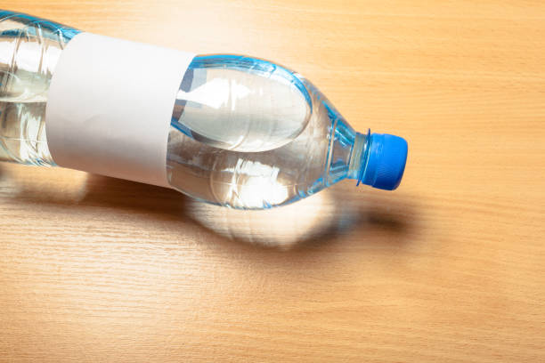 istock water bottle on the wooden table 1154054757