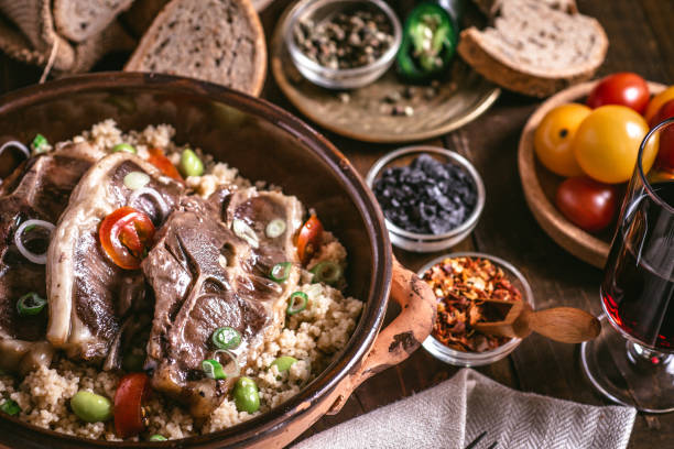 istock Roasted Lamb Loin Chops with Soybean and Couscous in Rustic Dish 1154060518