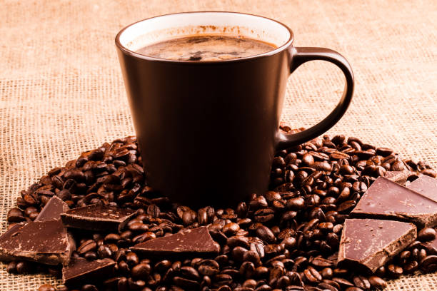 istock Dark chocolate lies on coffee beans before a cup 1154060628