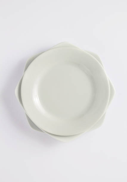 istock set of dishes and empty plate on white 1154060678