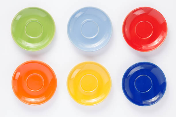 set of dishes and empty plate on white background