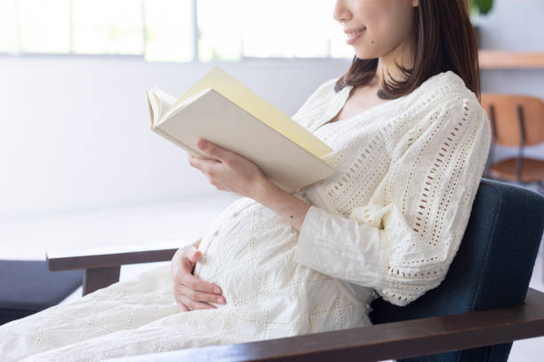 Pregnant woman reading a book