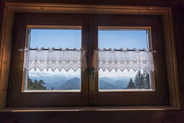 istock Alpine hut window with mountain view panorama in Bavaria 1154063856