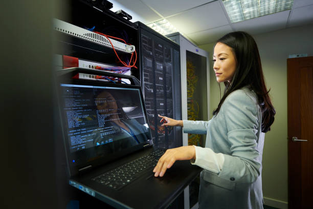 server room tech - data center computer programmer women fotografías e imágenes de stock