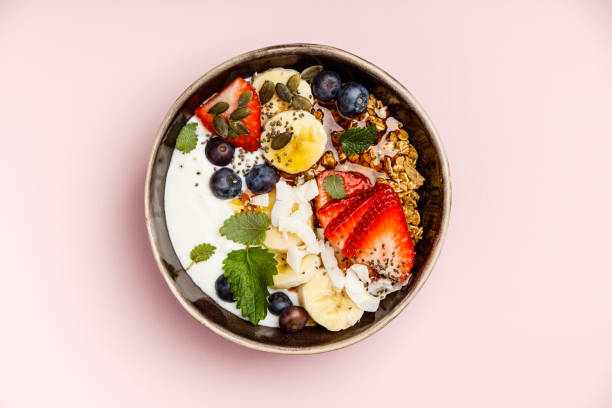 istock Healthy breakfast set on pink background, top view, copy space 1154065254