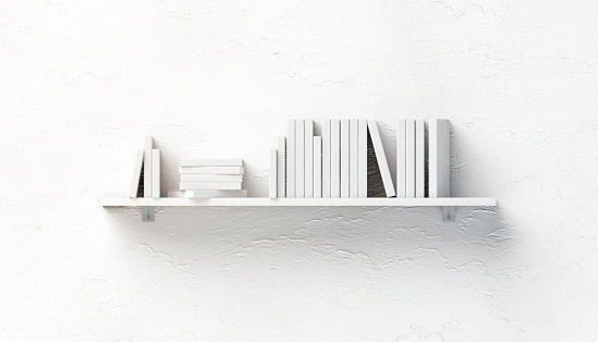 Blank white stack of books mockups on shelf mounted on wall, front view, isolated, 3d rendering. Empty bookshelf mock up fixed to textured ledge. Clear surface with heap of brochure and booklet.