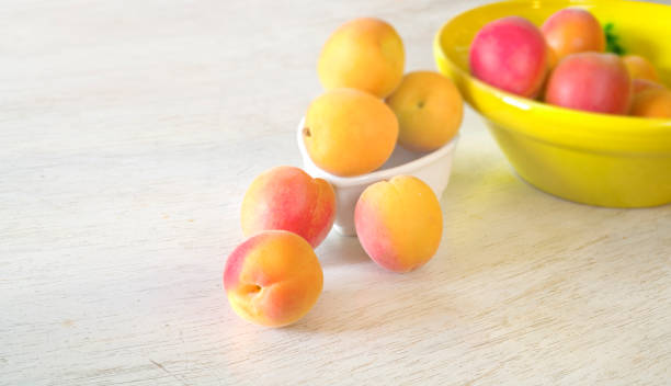 istock fresh and tasty apricots on a rustic table, selective focus, healthy eating, dieting concept 1154066632