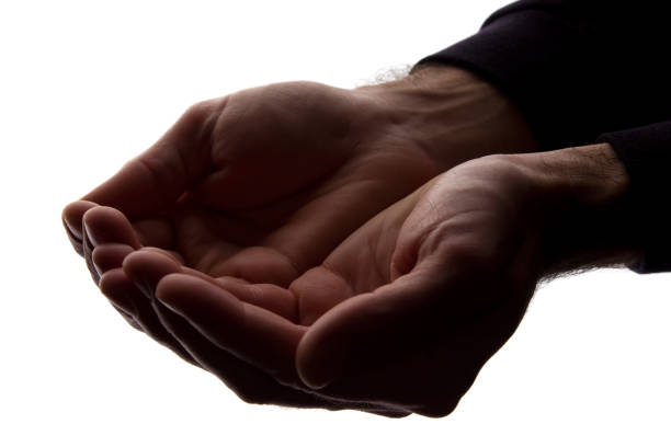 istock Men hands together, handful - silhouette 1154067636