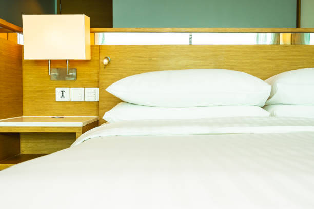 istock Beautiful luxury comfortable white pillow on bed decoration in bedroom 1154067760
