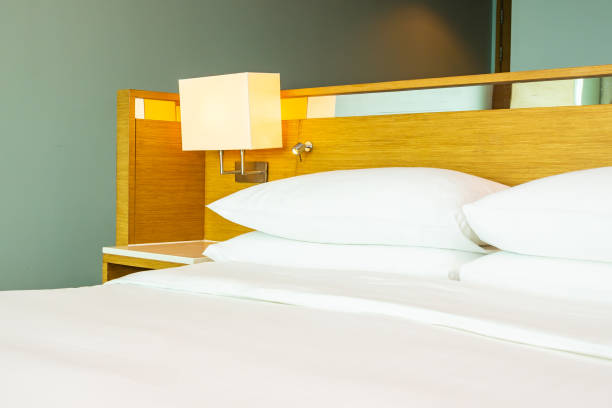 istock Beautiful luxury comfortable white pillow on bed decoration in bedroom 1154067773