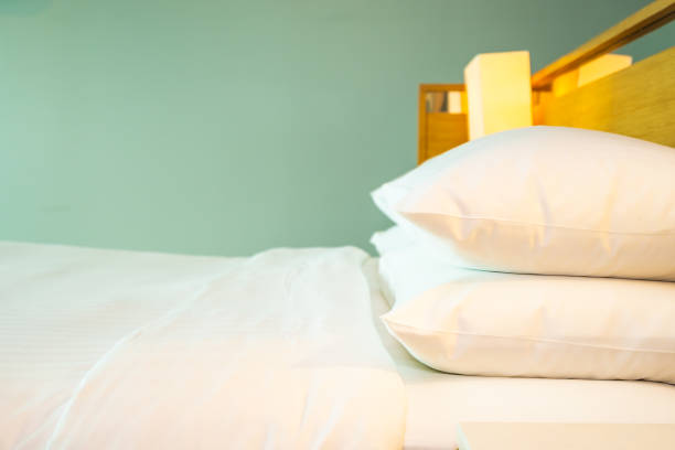 istock Beautiful luxury comfortable white pillow on bed decoration in bedroom 1154067864