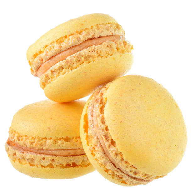 istock Yellow peach macaroon close up isolated 1154067986