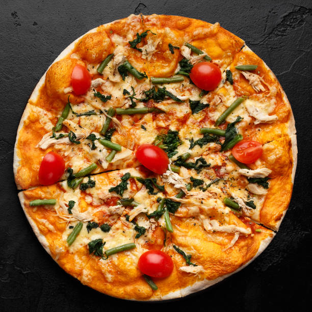 istock Italian pizza with asparagus and cherry tomatoes 1154068618