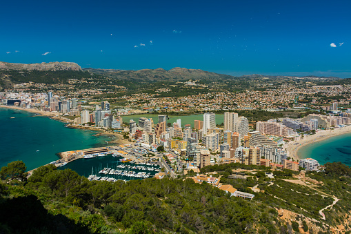 View of the area of apartments and hotels in Calpe, with the marina and the salt pans from the top of the rock of Ifach