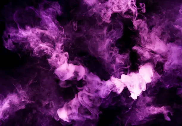 Photo of fusion of purple smoke in motion