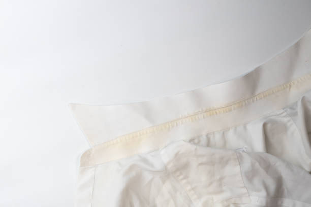 istock yellow dirty stain on white collar shirt 1154071701